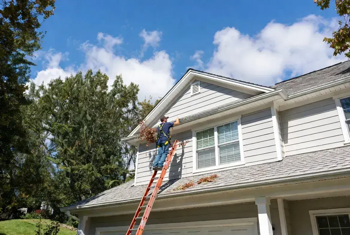 Professional gutter cleaning on a residential home in East Brainerd, TN