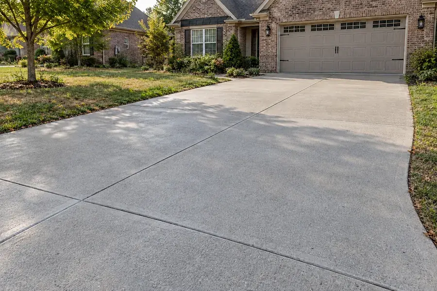Illustrative example: A clean broom-finished concrete driveway with a natural matte appearance